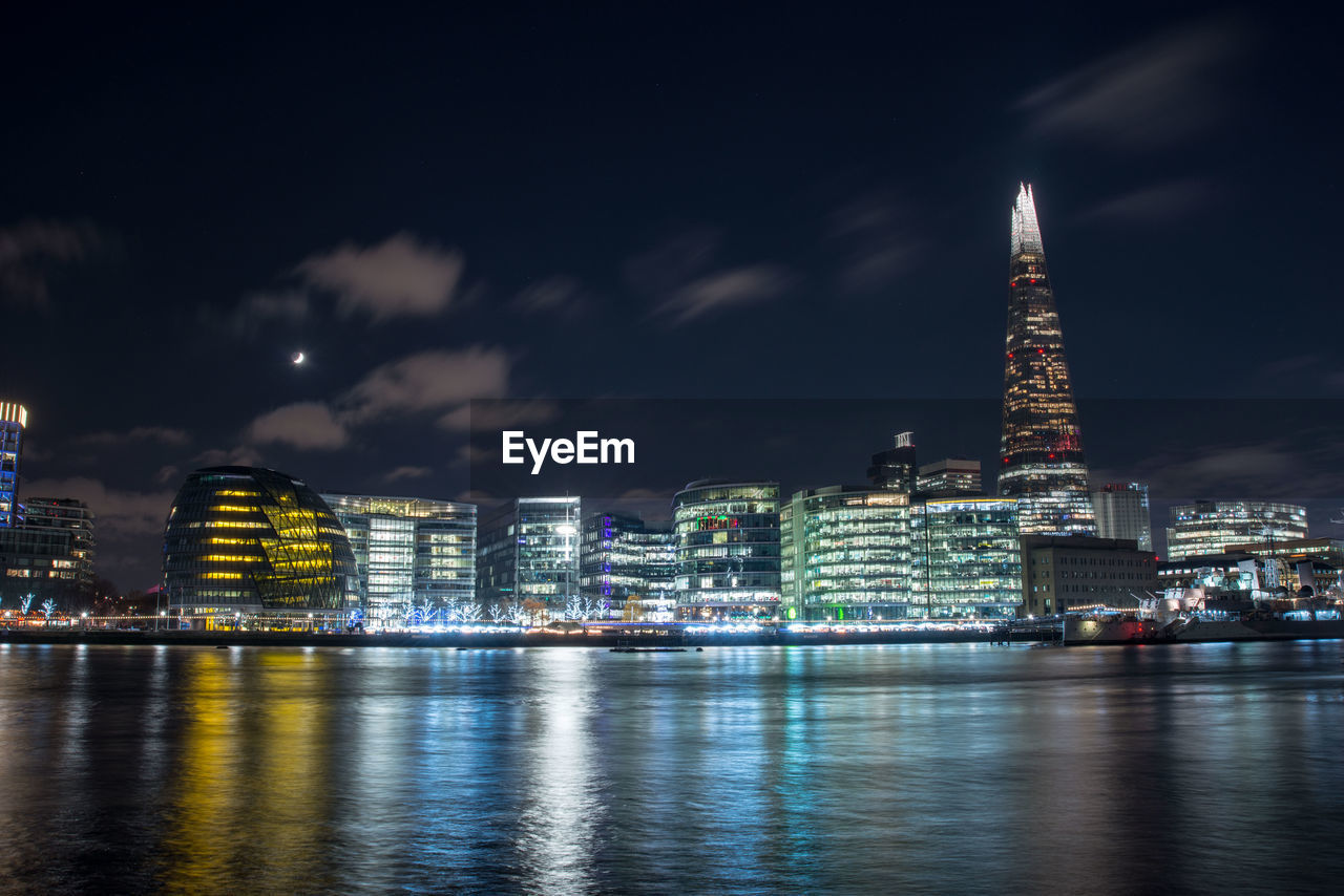 Illuminated buildings in city at night