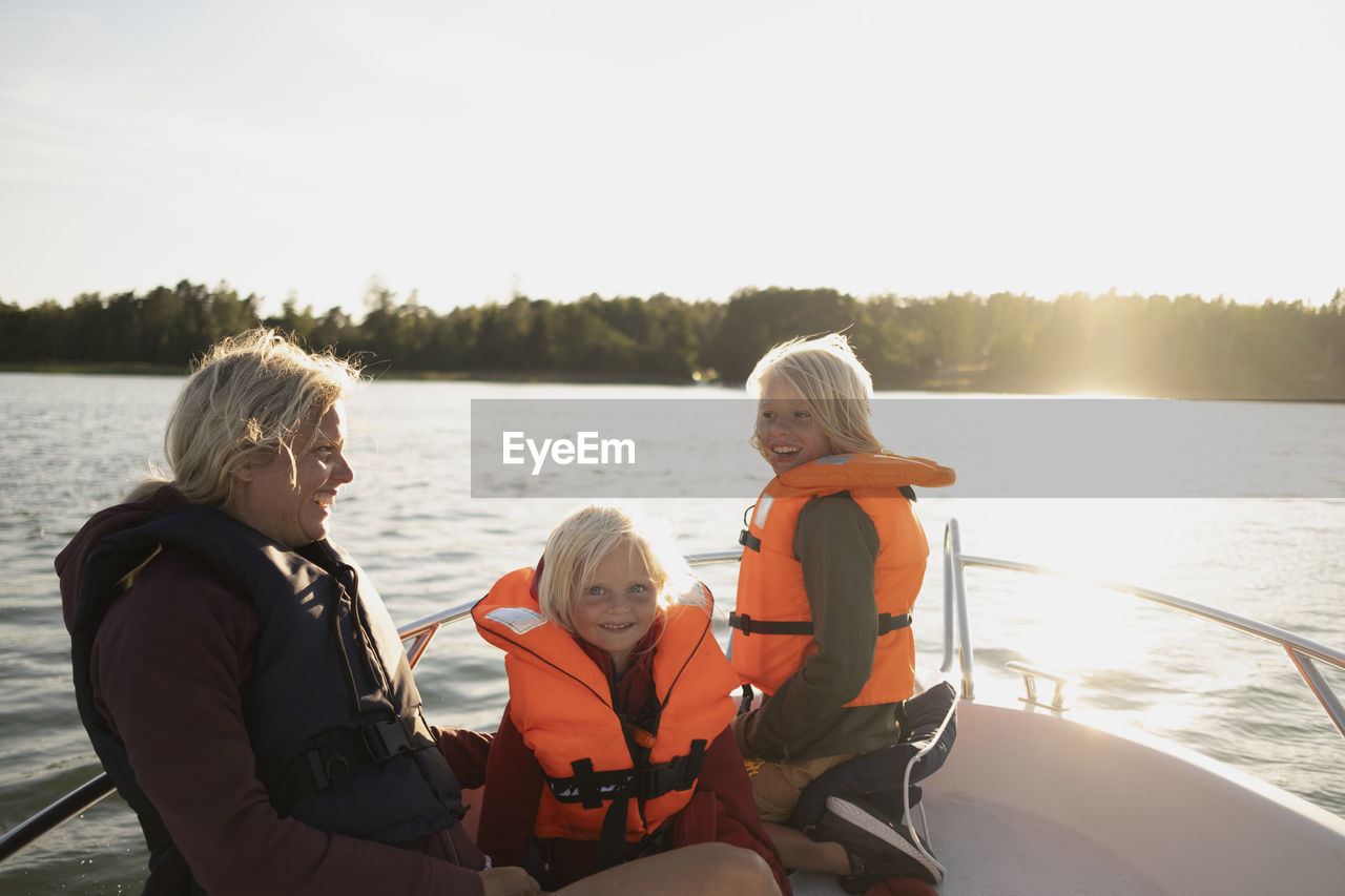 Mother with children on boat