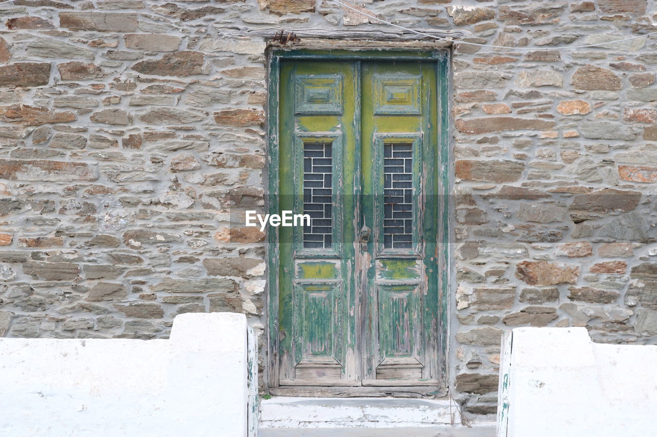 HOUSE WINDOW ON BRICK WALL