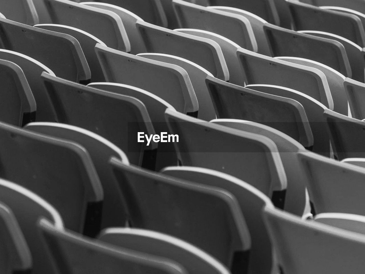 full frame shot of empty chairs in row