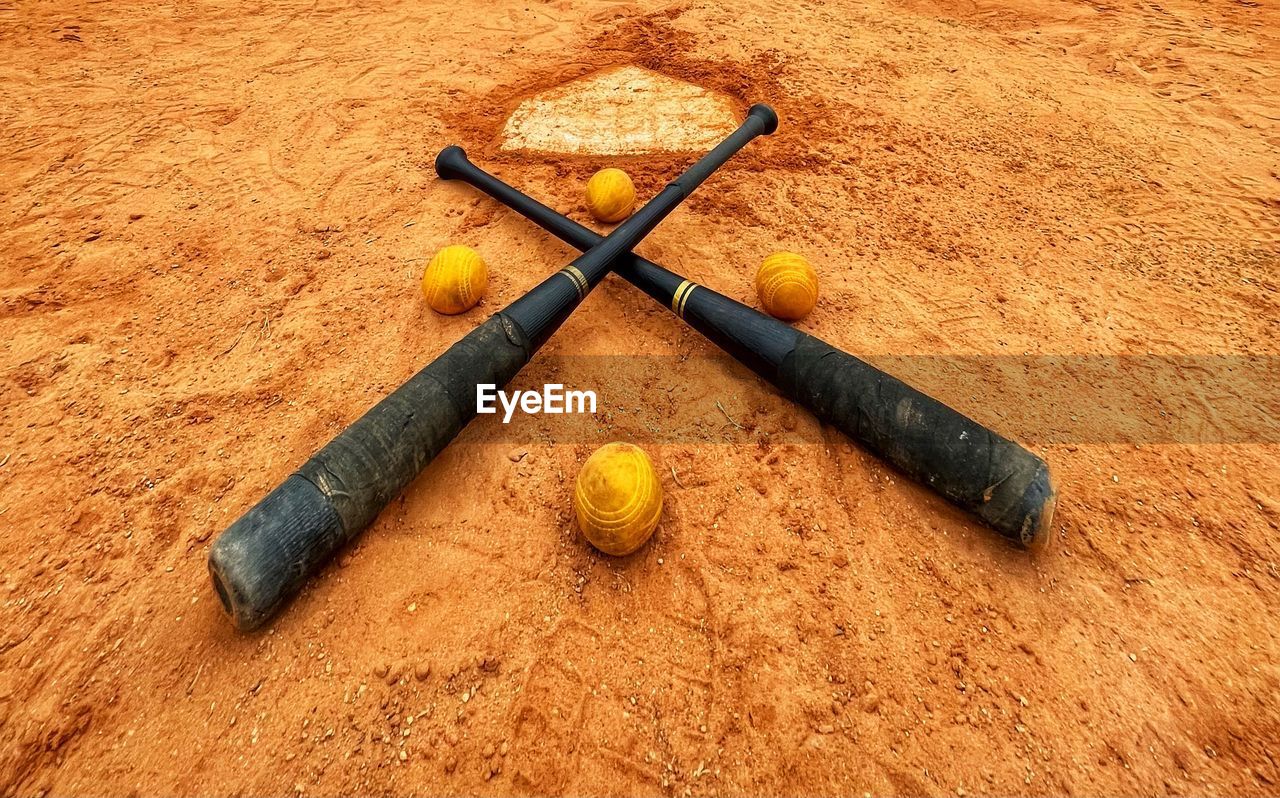 high angle view, sand, yellow, no people, sports, soil, wood, land, still life, ball, brown