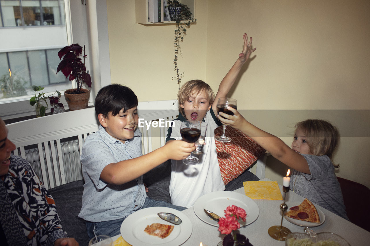 Children toasting at home