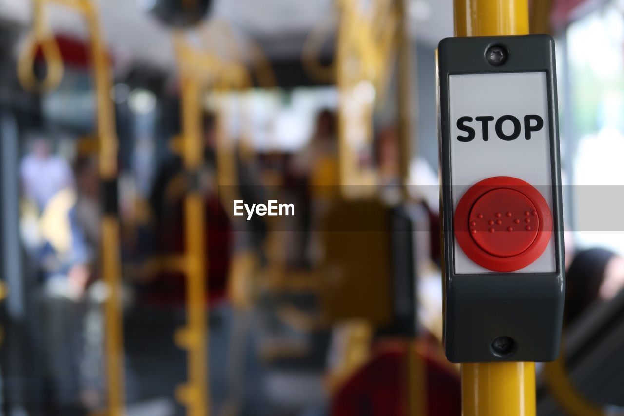 Close-up of stop sign in bus