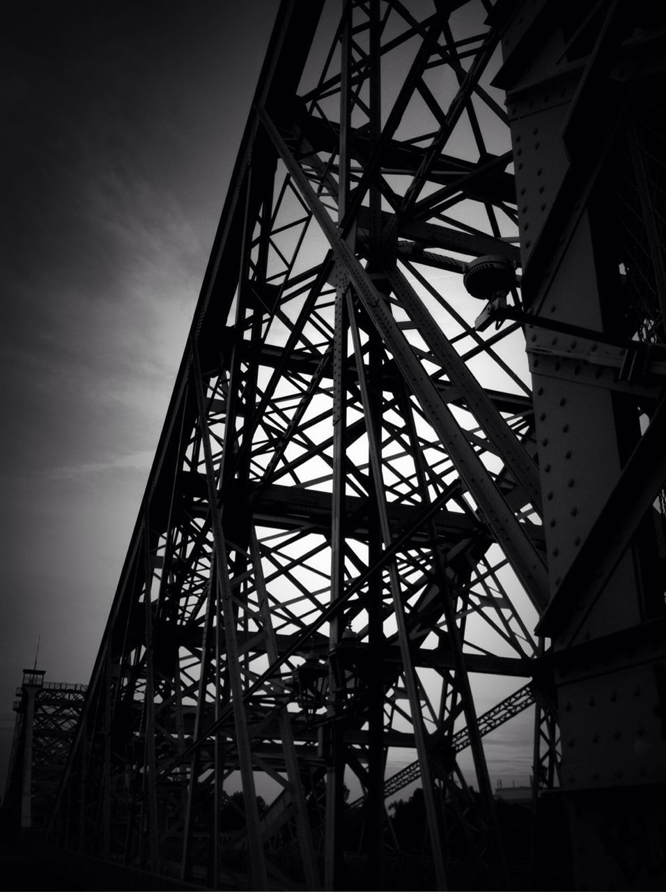 LOW ANGLE VIEW OF METALLIC STRUCTURE AGAINST SKY