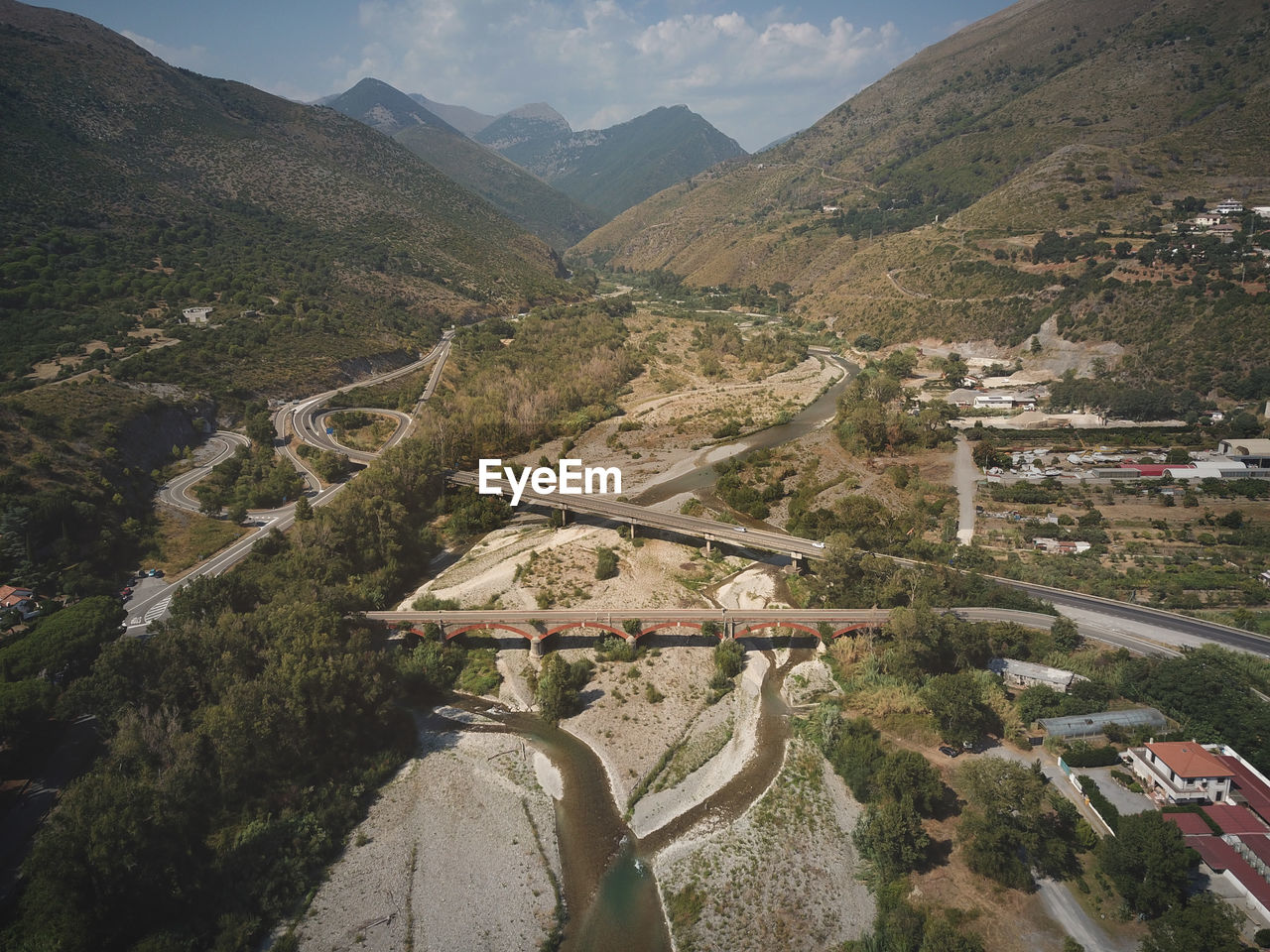 High angle view of road amidst mountains against sky