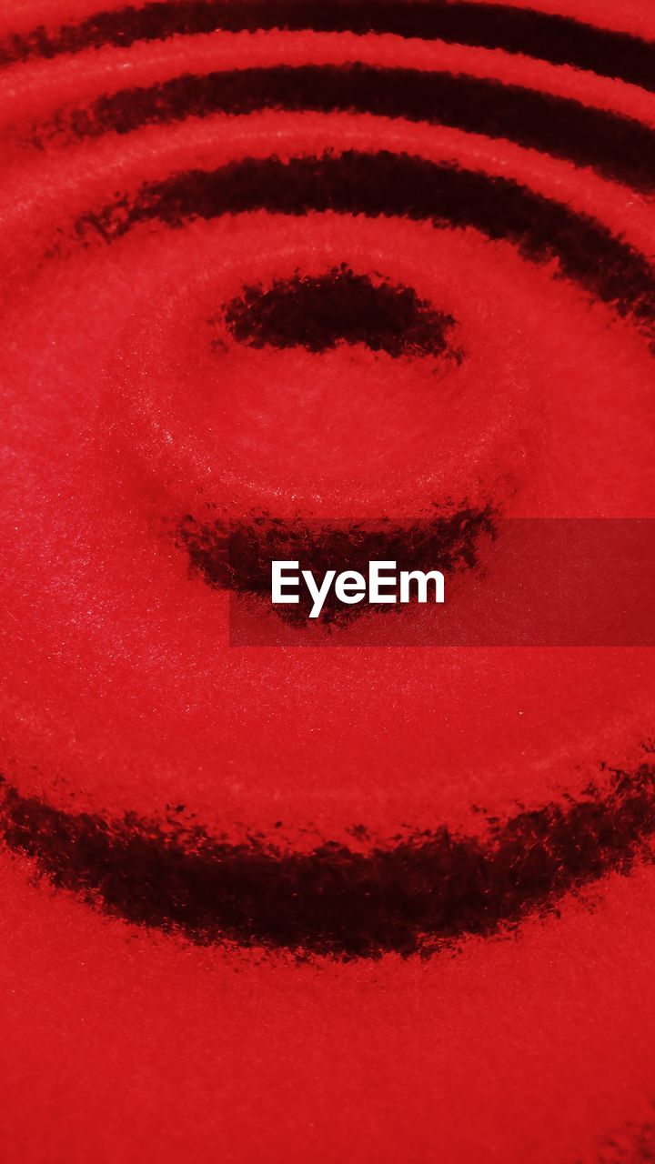 CLOSE-UP VIEW OF RED SURFACE