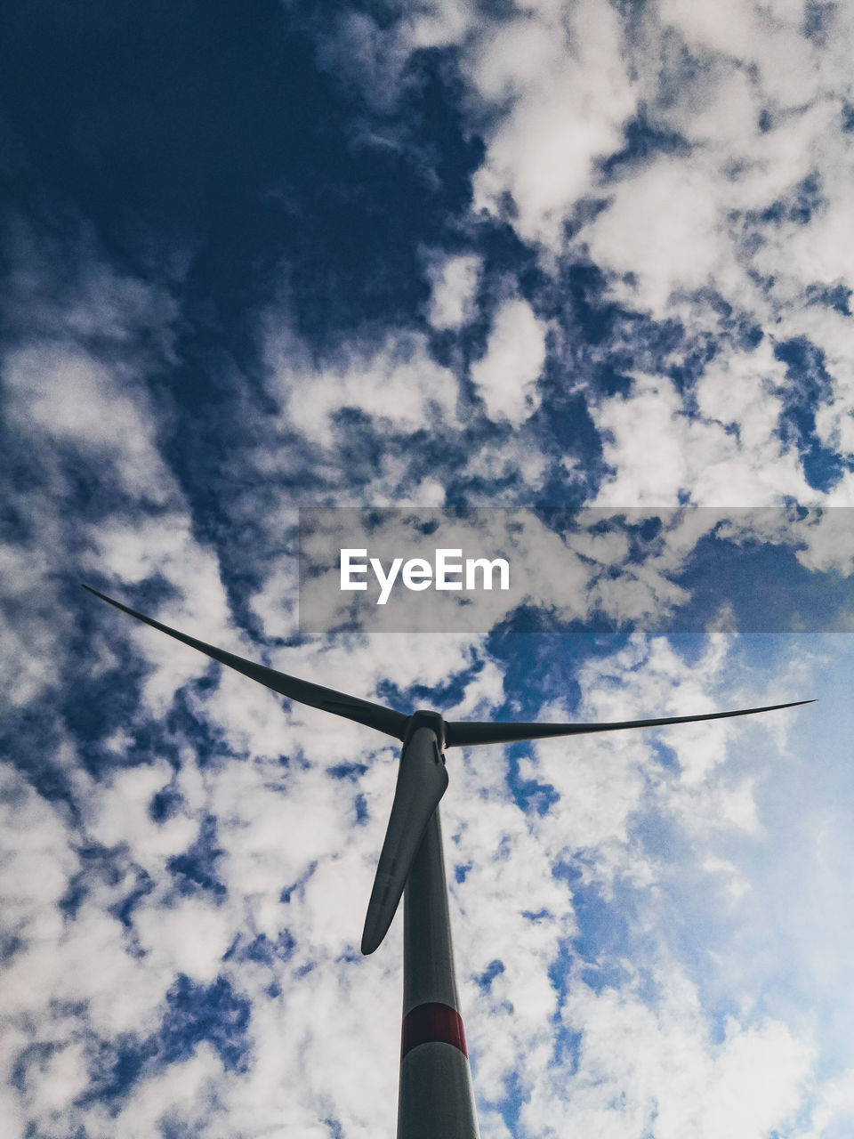 Low angle view of wind turbine against sky