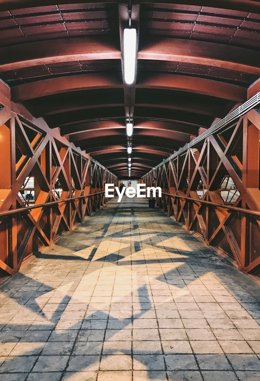 Illuminated footbridge at night
