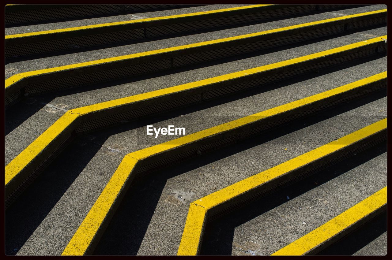 Full frame shot of steps with yellow stripes