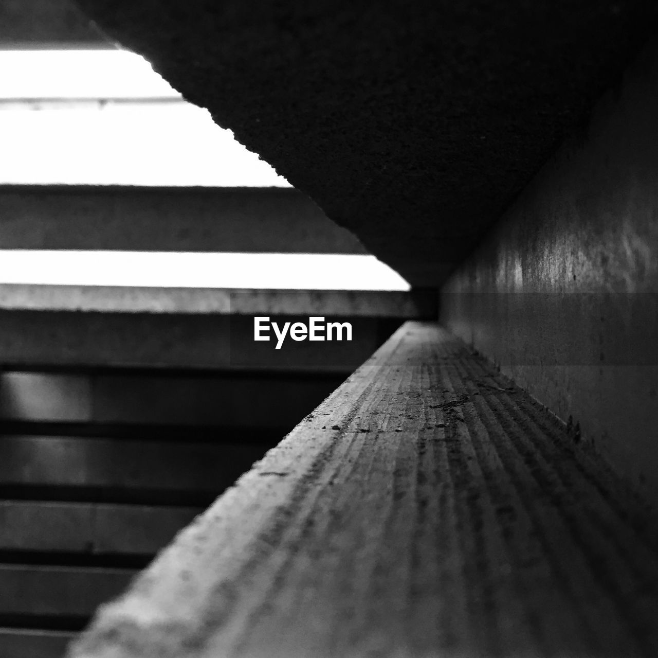 Close-up side view of empty shelf