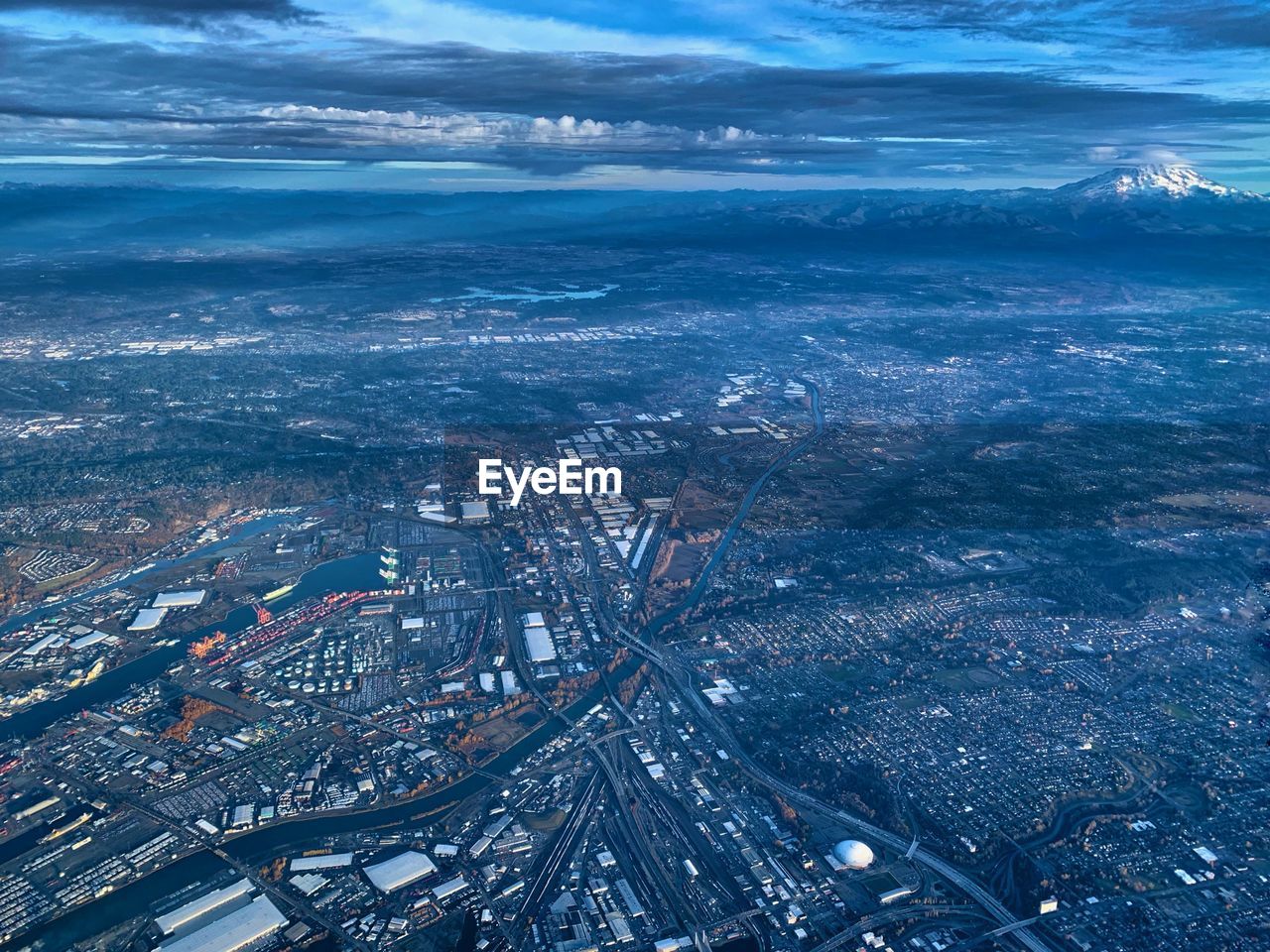 High angle view of city by sea against sky tacoma and rainier