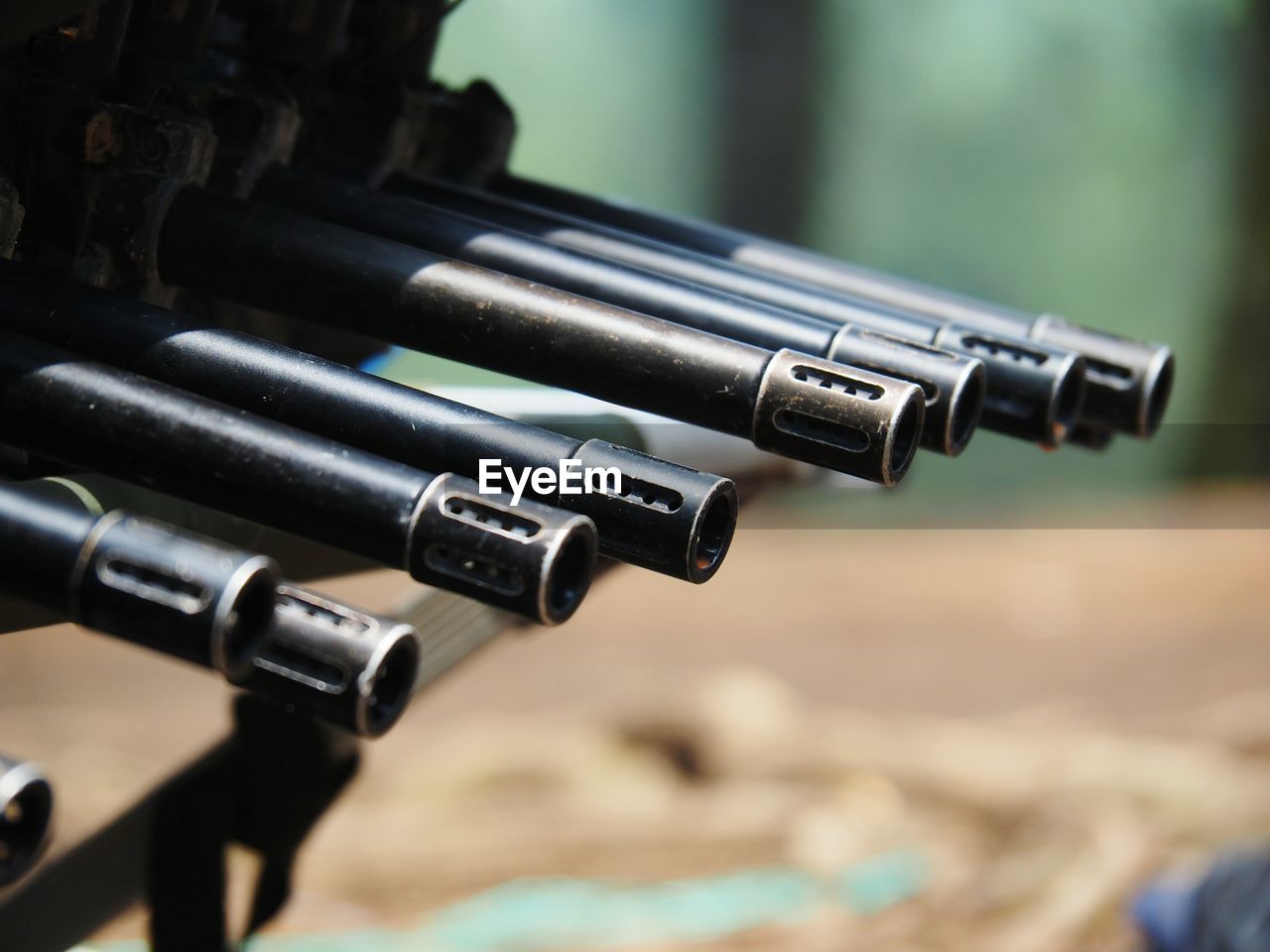 Close-up of rifles in row