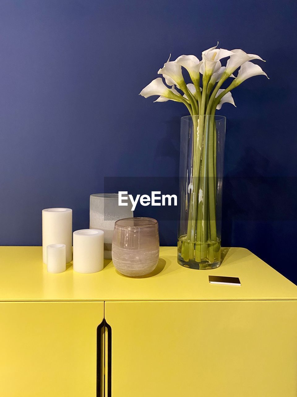 yellow, flower, vase, indoors, flowering plant, table, plant, no people, nature, lighting, freshness, still life, still life photography, domestic room, arrangement, food and drink, container, home interior, studio shot, household equipment, furniture, home, food, green