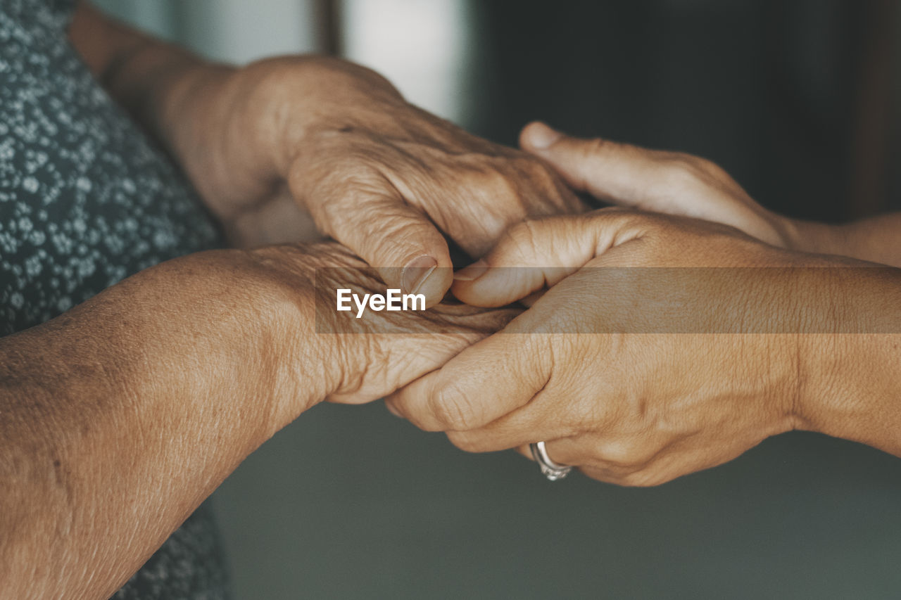 cropped image of man holding hands