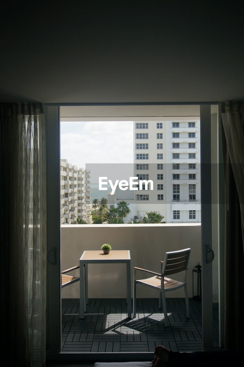 Buildings seen through window. balcony view in miami.