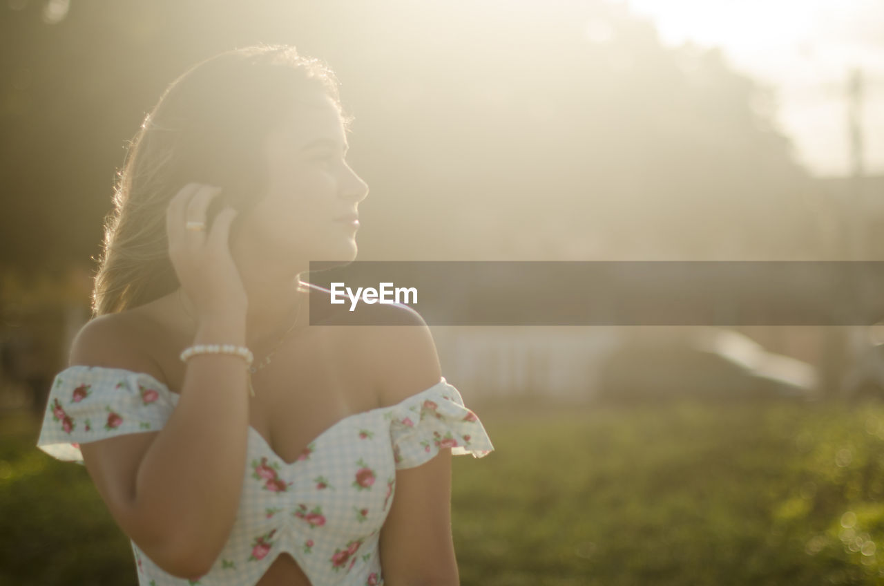 Midsection of woman looking away