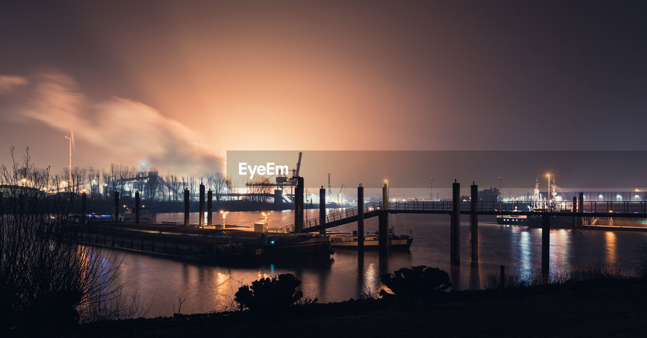 Industry against sky at night