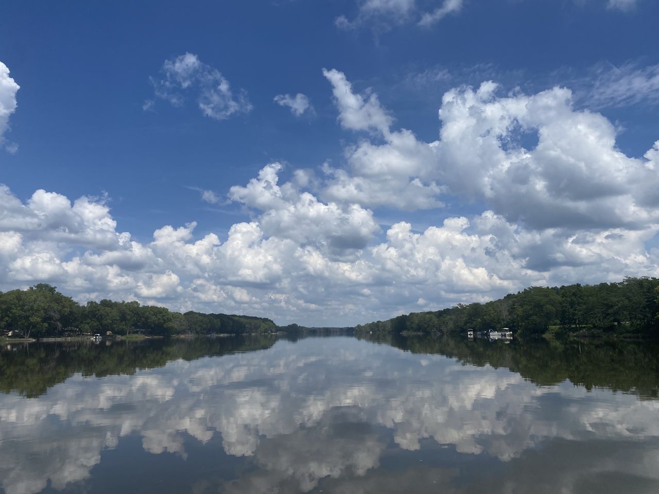 water, sky, reflection, cloud, lake, scenics - nature, beauty in nature, nature, tranquility, environment, body of water, landscape, tree, tranquil scene, no people, blue, plant, mountain, travel, day, travel destinations, outdoors, forest, reservoir, idyllic, non-urban scene, land, tourism