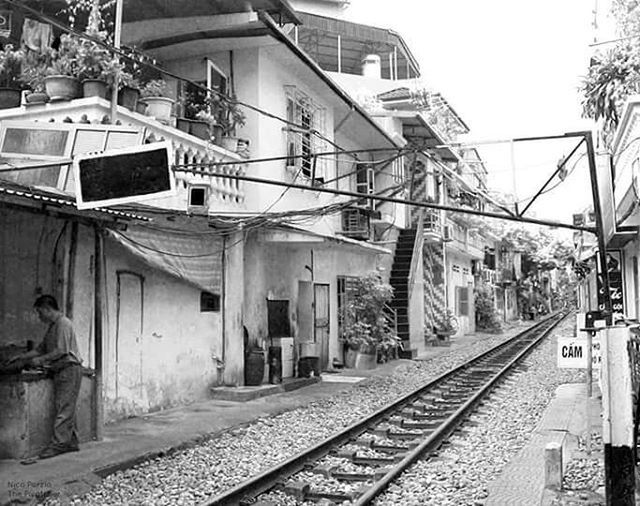 RAILROAD TRACKS ON RAILROAD STATION PLATFORM