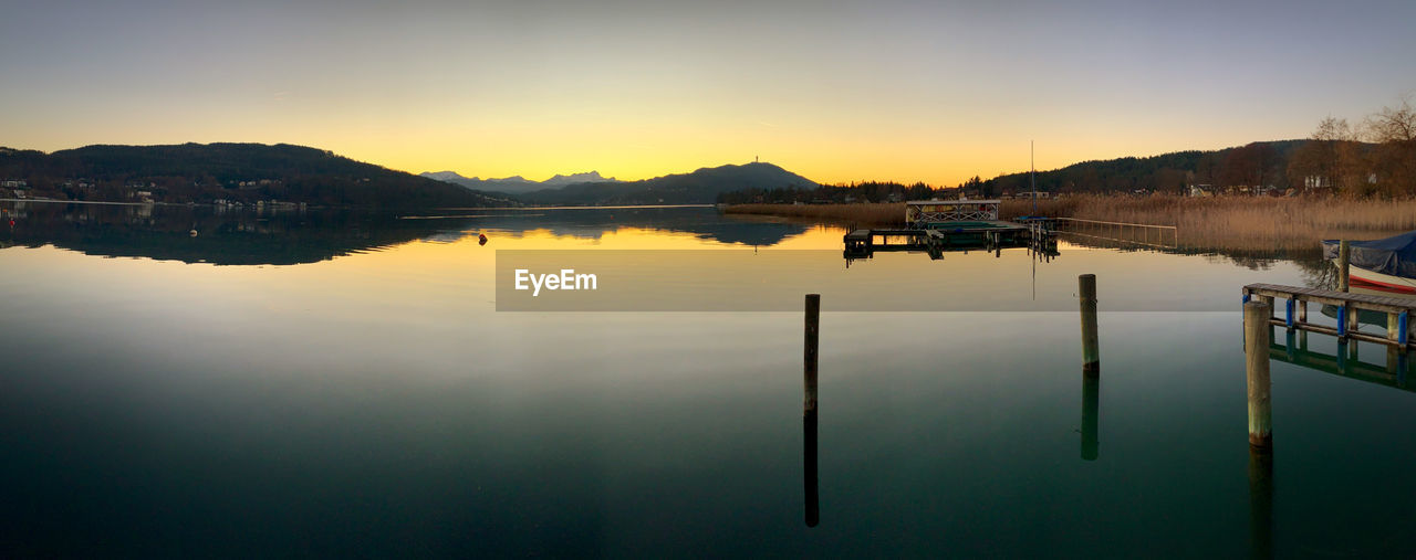 Scenic view of lake against sky during sunset