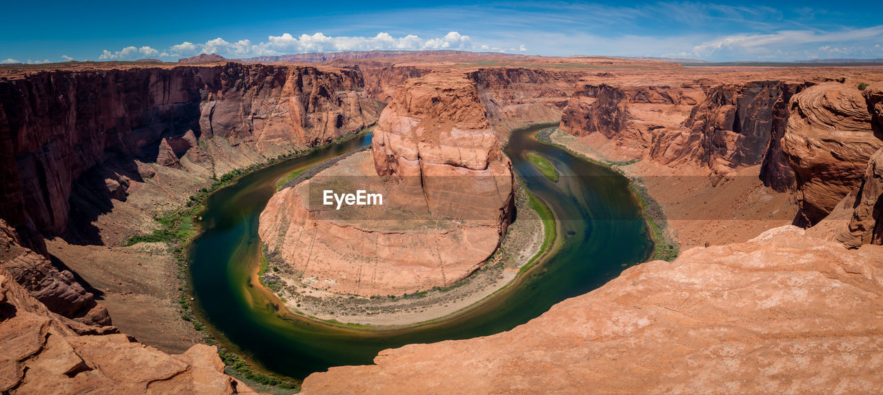 Scenic view of rock formations against sky