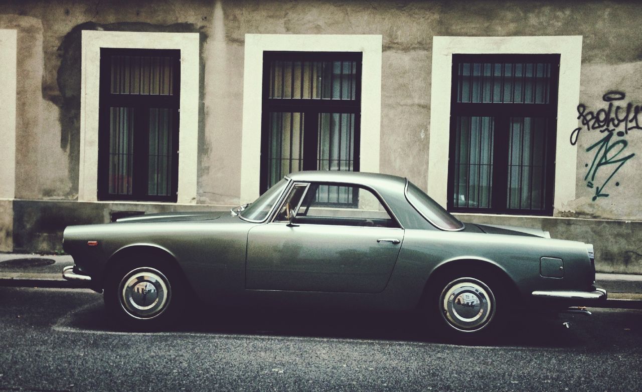 Vintage car on street outside house