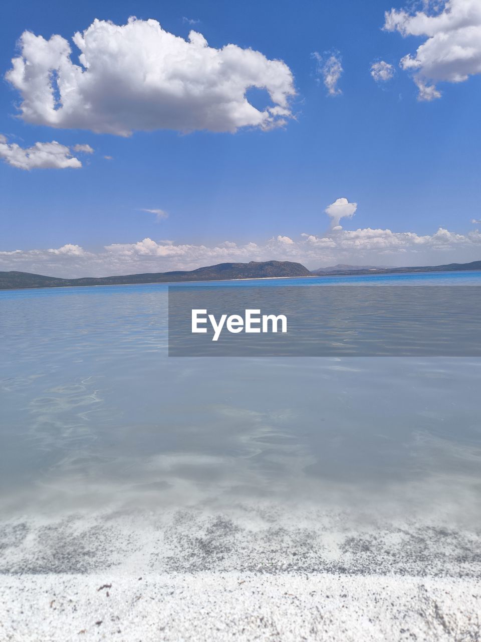 sky, cloud, water, scenics - nature, beauty in nature, sea, nature, land, environment, landscape, blue, tranquility, ocean, tranquil scene, body of water, shore, horizon, travel destinations, ice, travel, no people, day, reflection, beach, snow, mountain, outdoors, lagoon, tourism, sand, idyllic, coast, holiday, winter, wave, trip, vacation, cold temperature, cloudscape, non-urban scene, sunlight