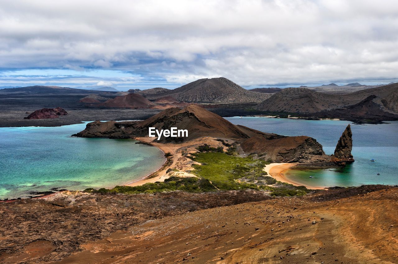 SCENIC VIEW OF SEA AND MOUNTAIN AGAINST SKY