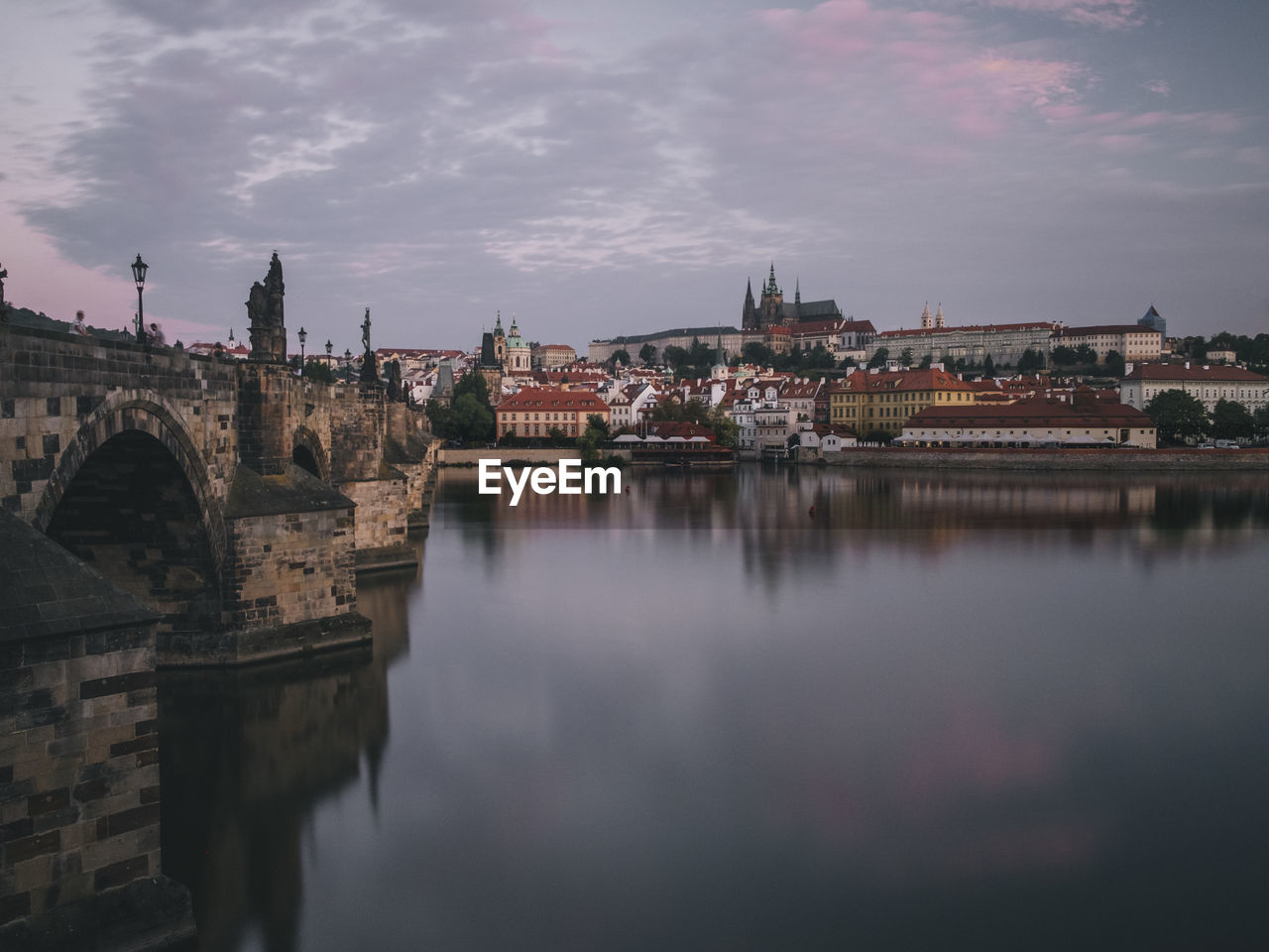 Sunrise view of charles bridge and prague castle over river vltava.