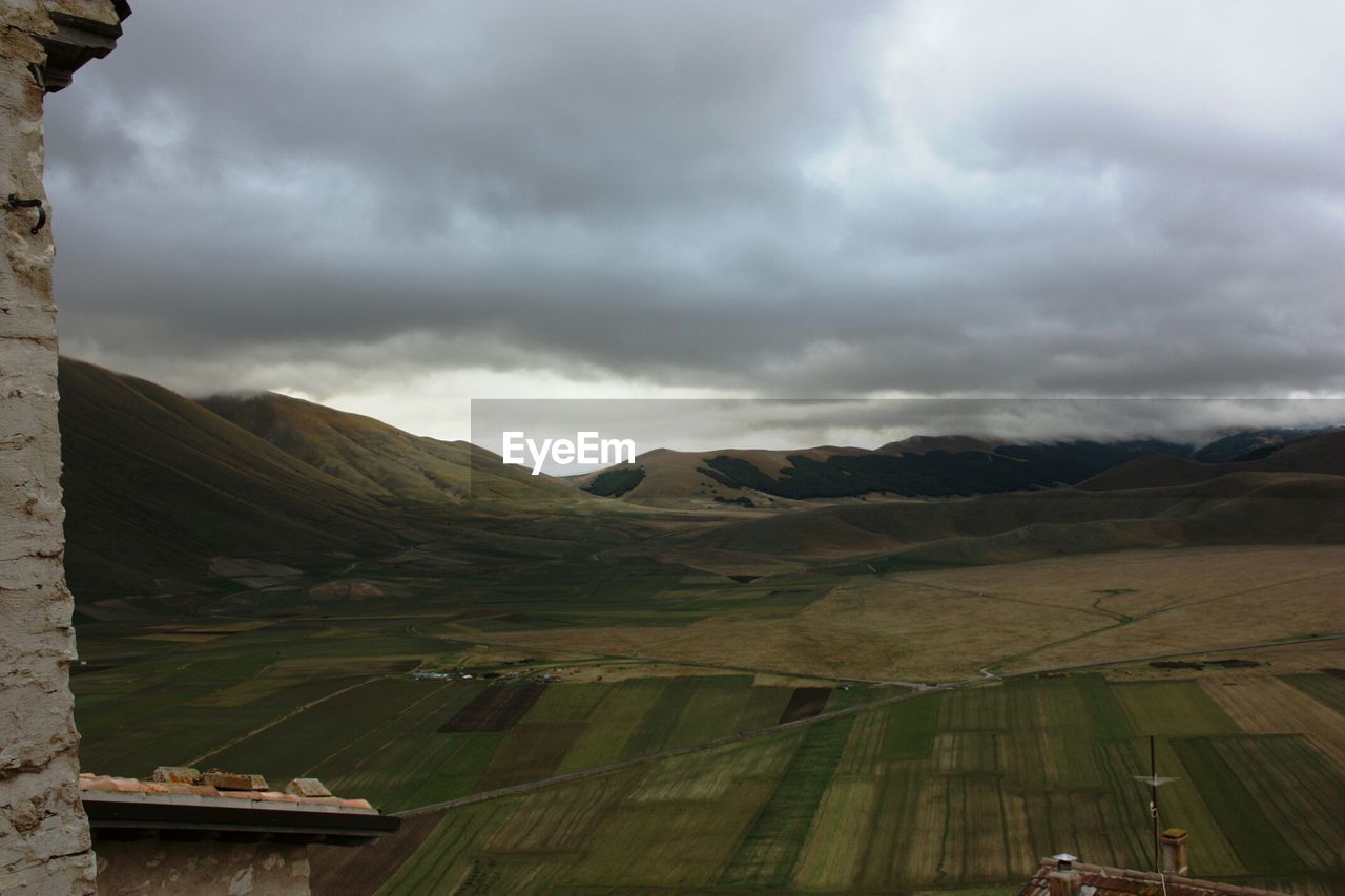 CLOUDY SKY OVER MOUNTAINS