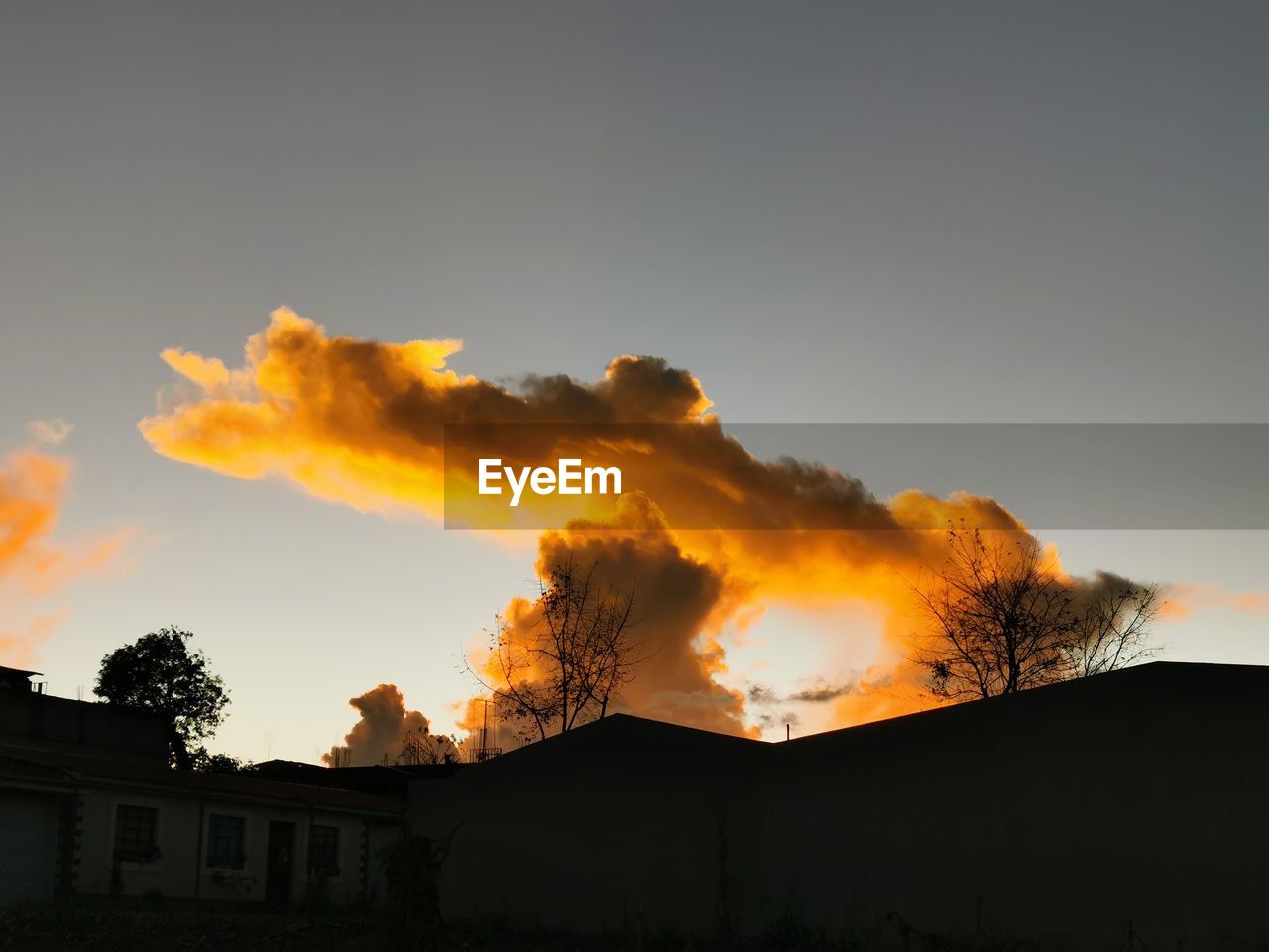 Low angle view of silhouette buildings against sky during sunset