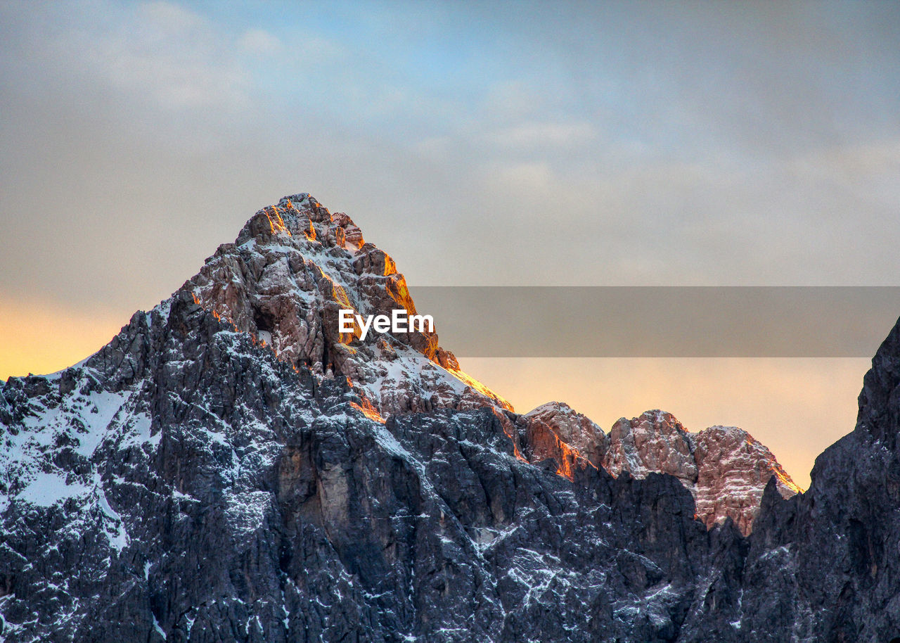 Rock formation against sky during winter