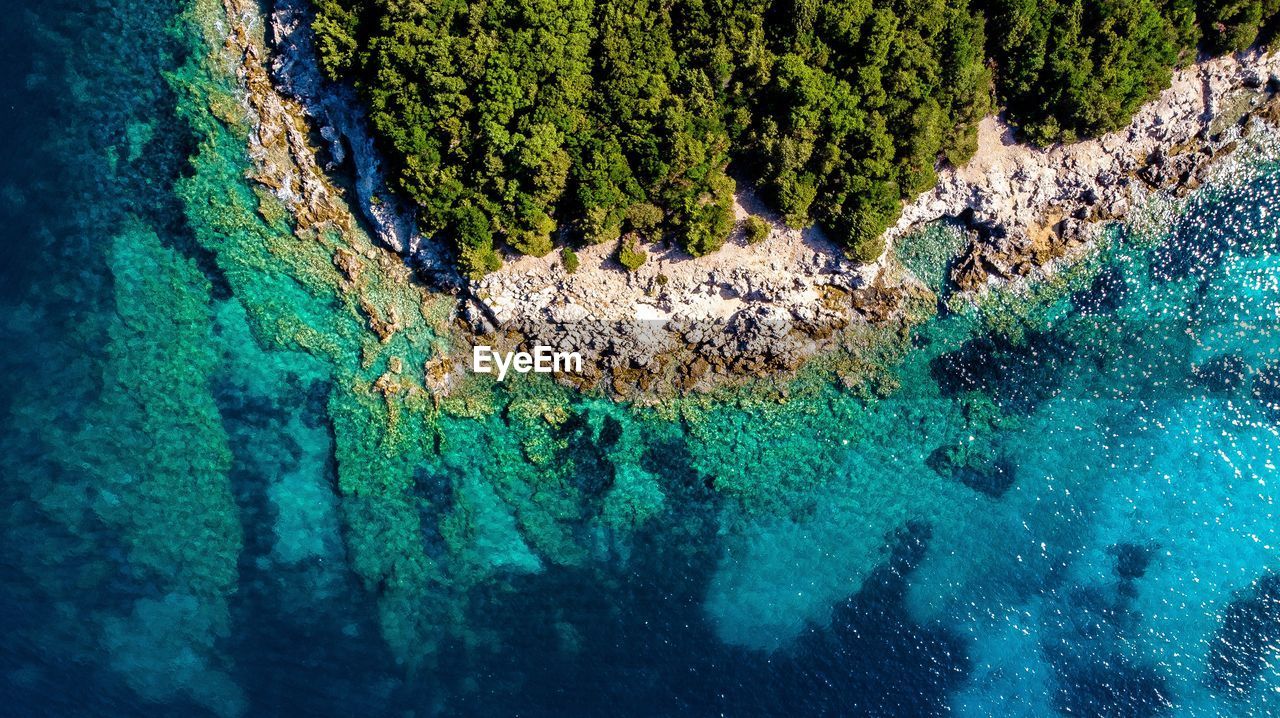 High angle view of rock formation in sea