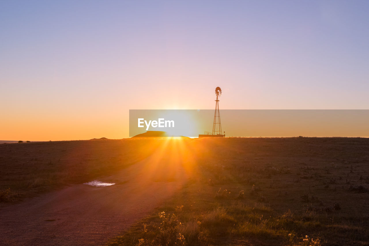 SCENIC VIEW OF SUNSET OVER LAND