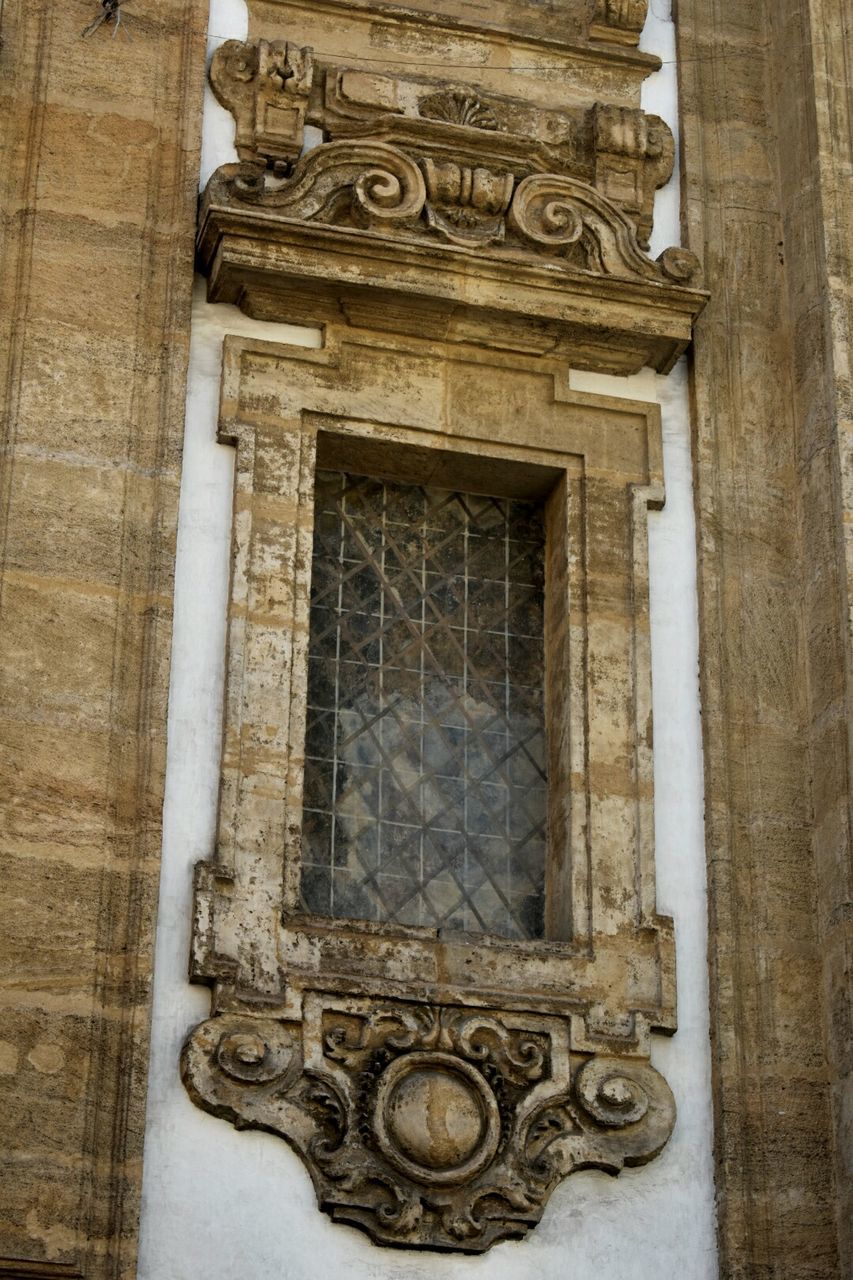 CLOSE-UP OF CLOCK TOWER WITH CHURCH