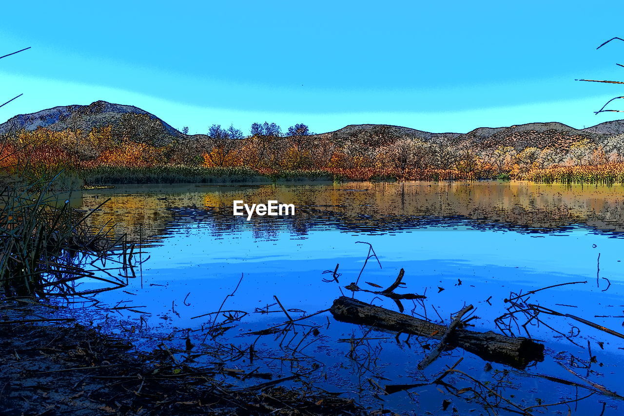 LAKE AGAINST CLEAR BLUE SKY