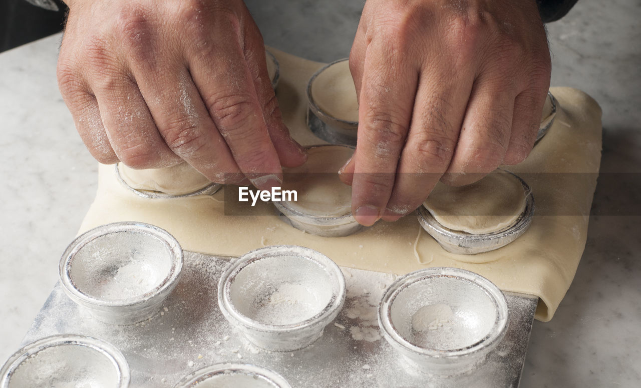 Cropped hands preparing food