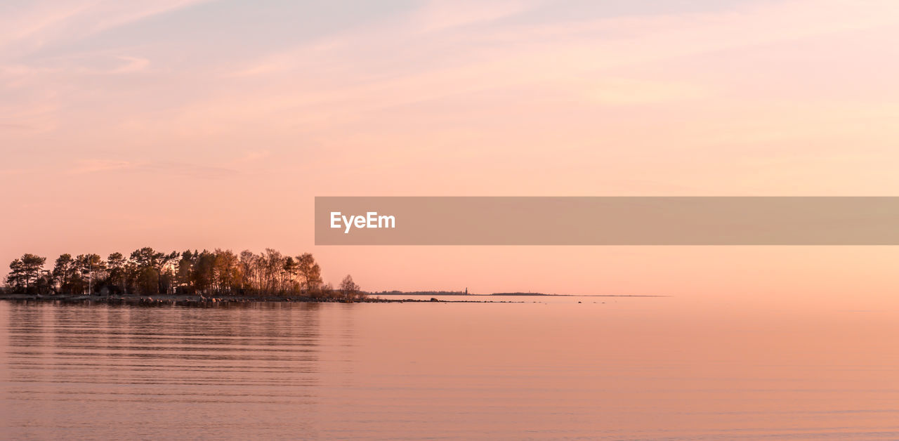 Scenic view of sea at sunset