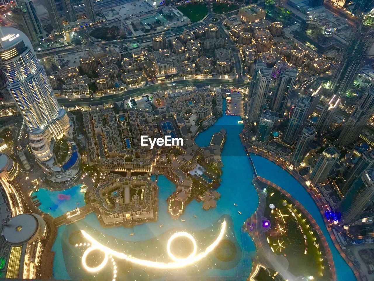 High angle view of illuminated buildings in city at night