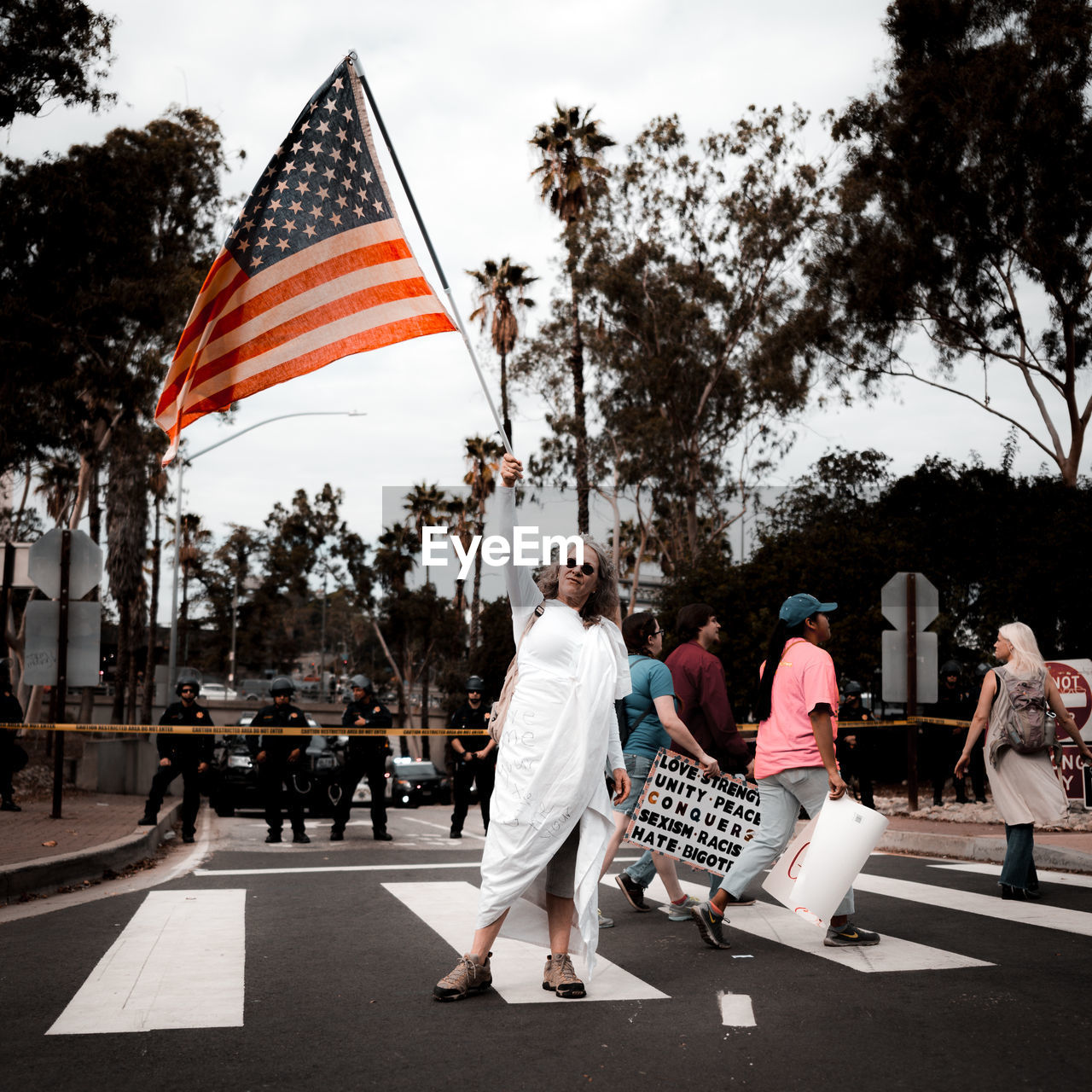 PEOPLE ON STREET AGAINST SKY