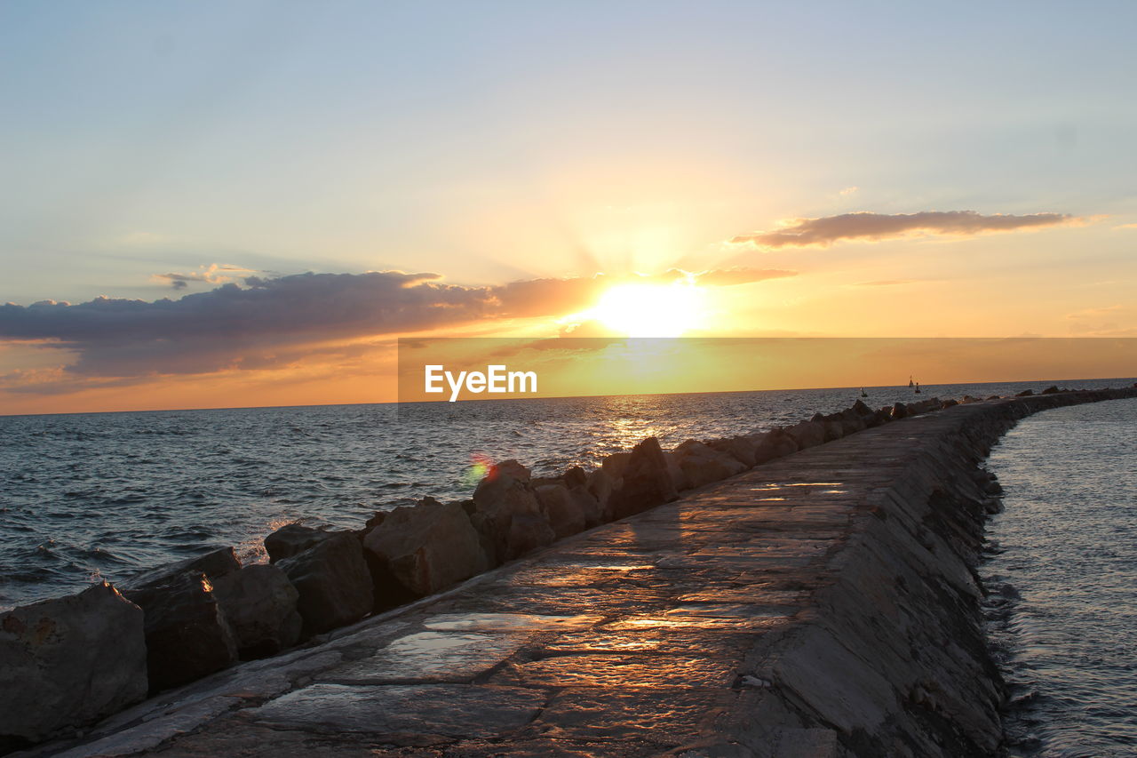 Scenic view of sea against sky during sunset