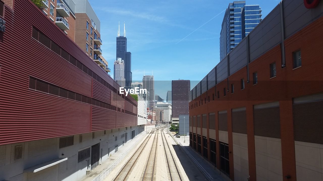 VIEW OF CITY STREET AGAINST SKY