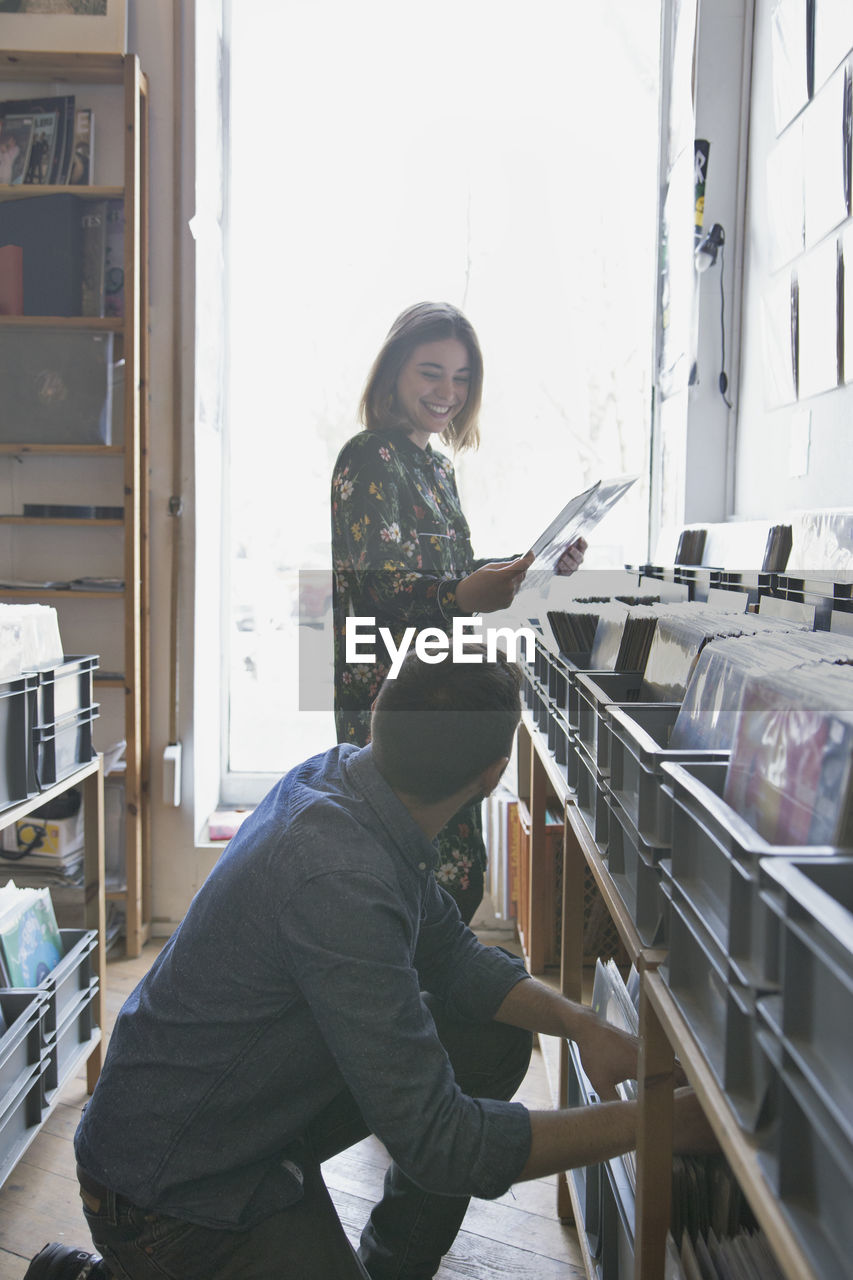 Young couple shopping for records together