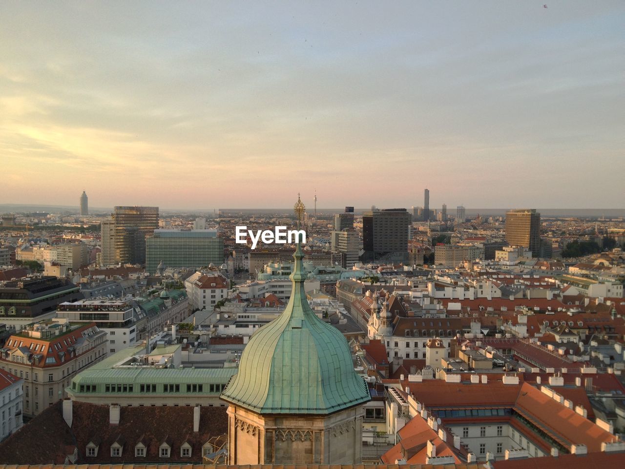 Cityscape against sky at sunset