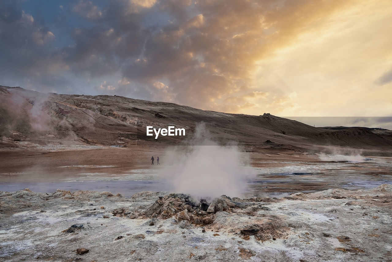 Scenic view of steaming fumarole in geothermal area of hverir at namafjall