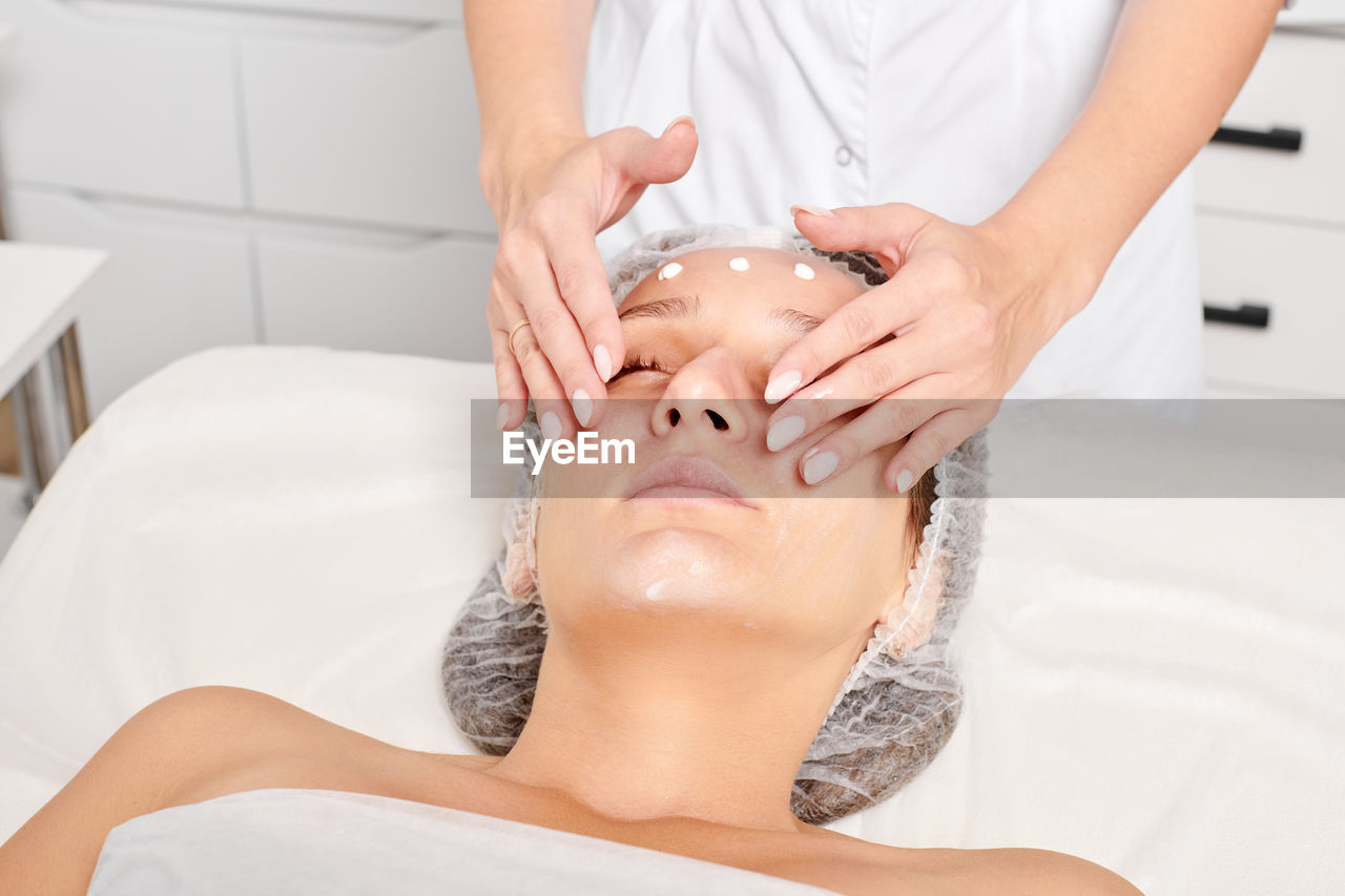 body care, beauty spa, spa treatment, adult, women, relaxation, beauty treatment, health spa, wellbeing, human face, skin, skin care, massaging, healthcare and medicine, lying down, female, young adult, lifestyles, human skin, indoors, alternative therapy, facial mask - beauty product, two people, towel, spa, cleaning, human head, therapy, eyes closed, patient, hygiene, hand, food, exfoliation, beauty product, person, moisturizer, medicine, washing, domestic bathroom, food and drink, bathroom, body care and beauty, luxury, care, professional occupation, applying, domestic room, portrait, eyebrow, nose, wealth, tranquility, fashion, lying on back, body conscious, comfortable, nature, freshness, taking a bath