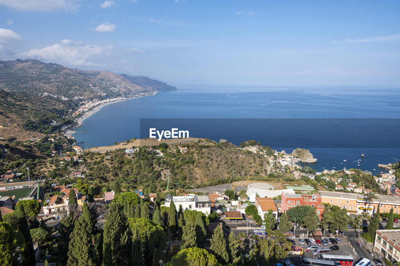 Aerial wide angle view of taormina and its beautiful coastline