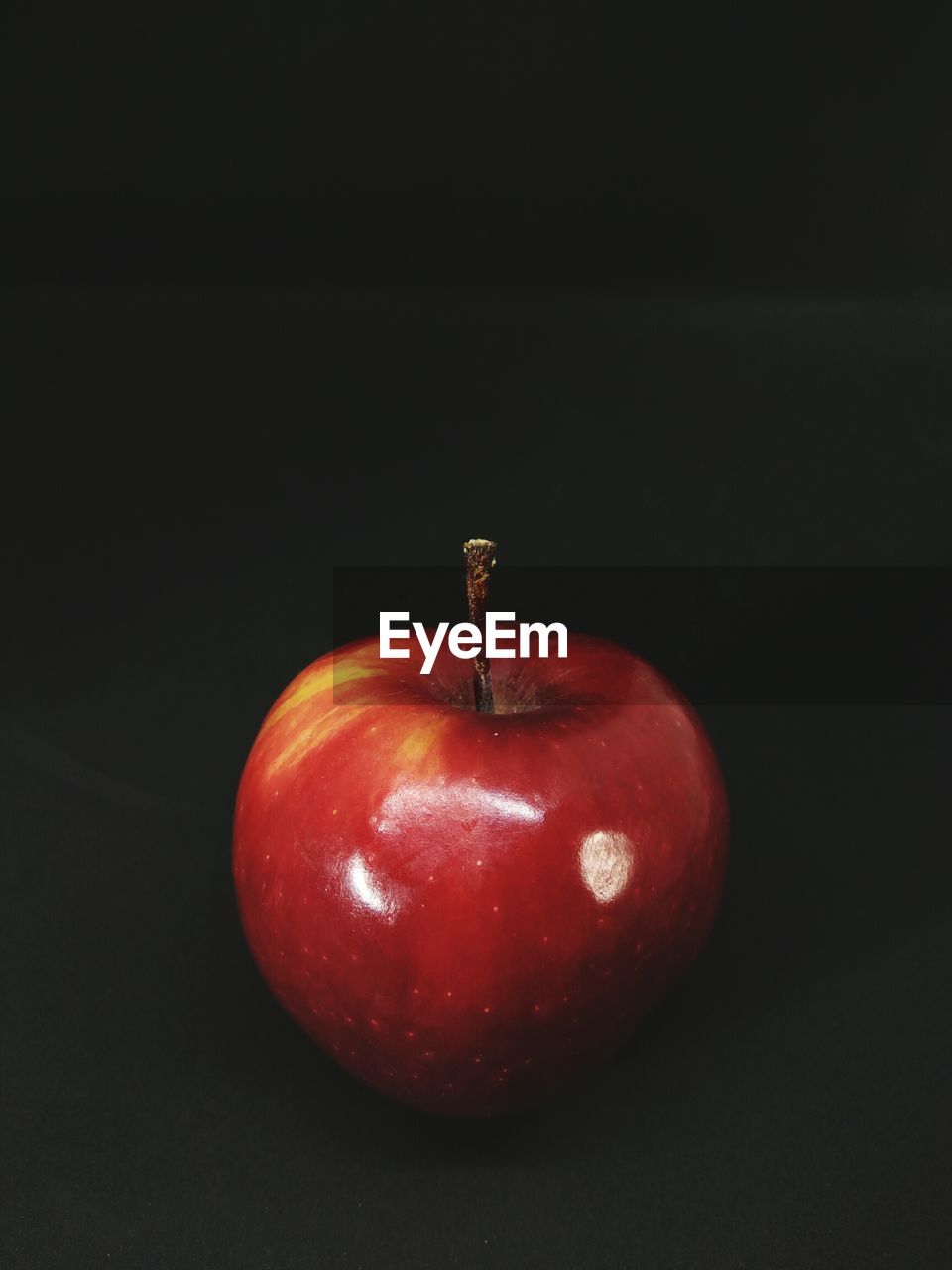 Close-up of apple against black background