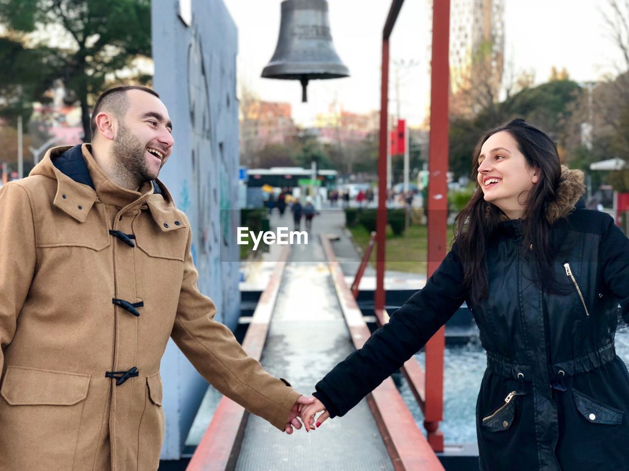 Couple holding hands at park