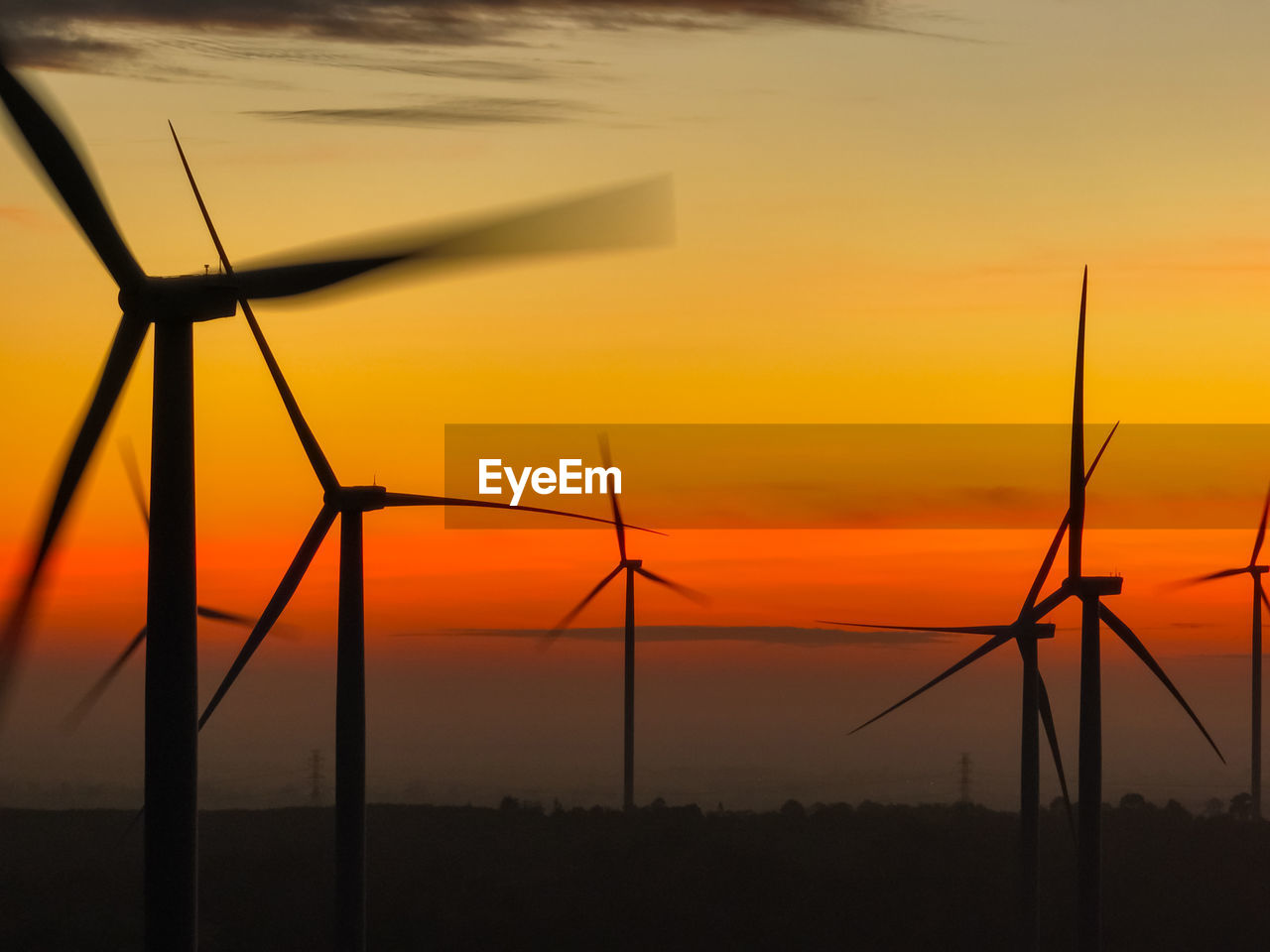 Wind farm landscape against sunset sky. wind energy. wind power. sustainable and renewable energy.